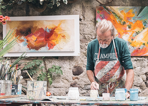 Man paints pottery