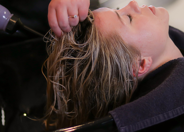 Woman getting her hair colored at a salon
