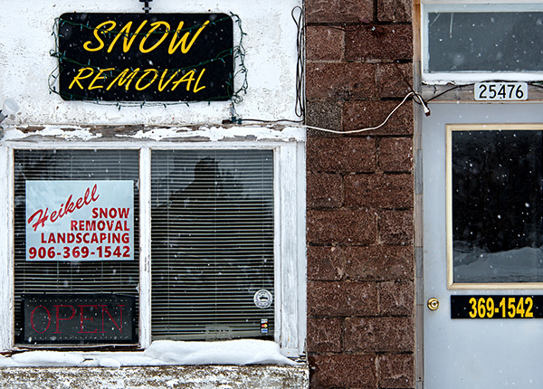 Building with Snow Removal sign