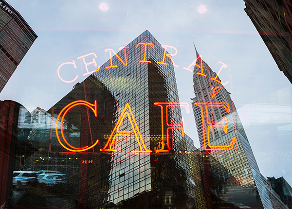 Window with Central Cafe neon sign in the window