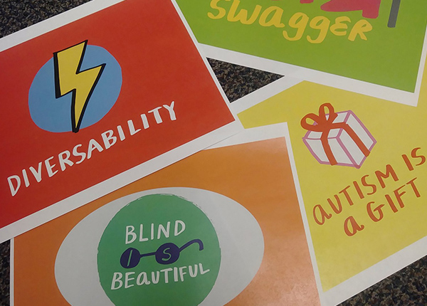 Posters that say 'diversability,' 'blind in beautiful,' and 'autism is a gift'