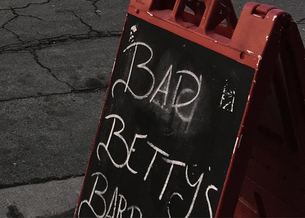 Sign that says Bad Betty's writen in chalk 
