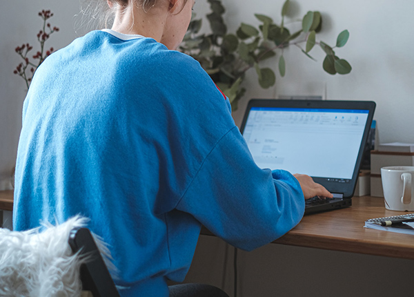 Person typing on laptop