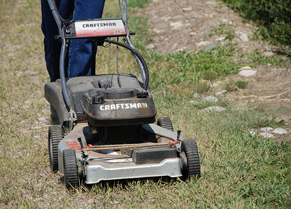 Person mowing lawn