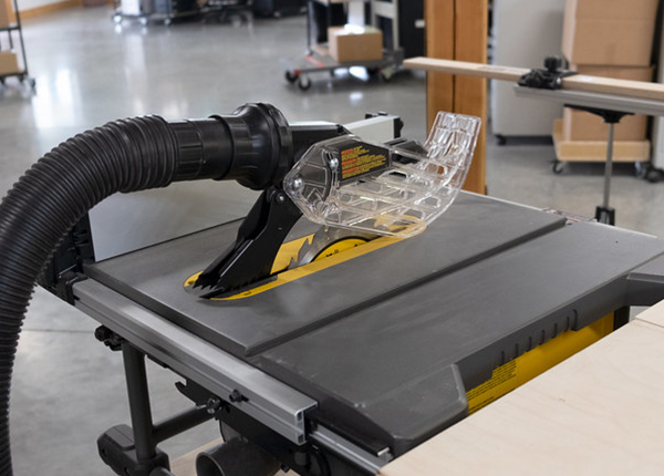 A saw with a vacuum in a workshop