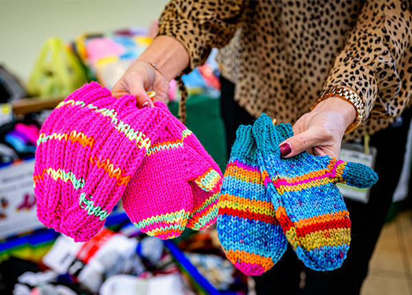 Person holding knitted mittens