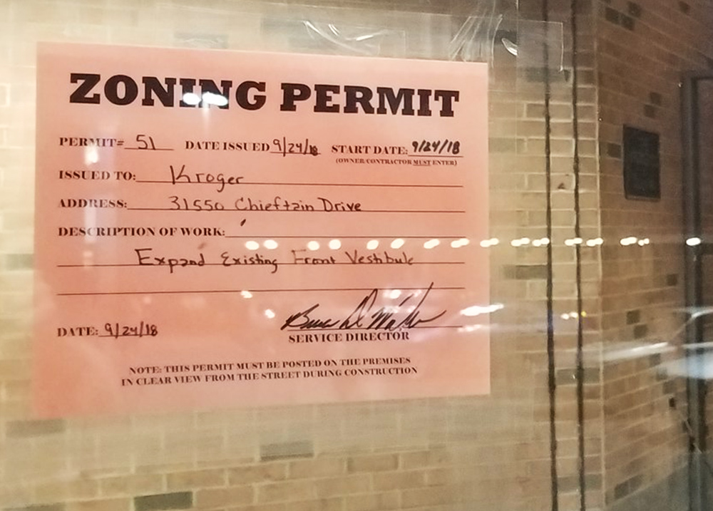 Zoning permit hanging in a window