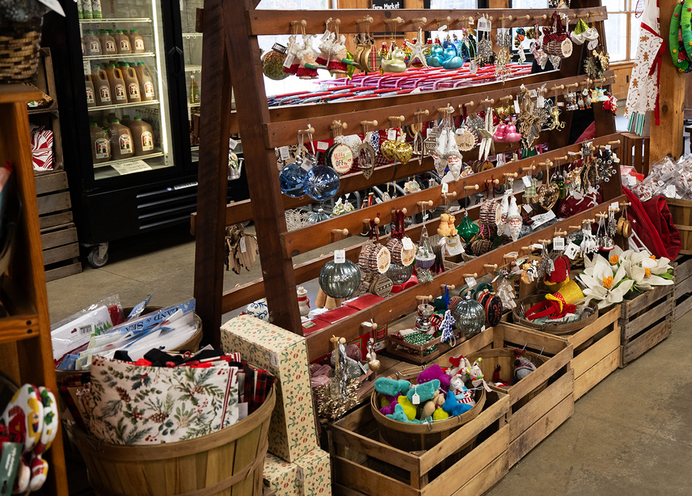 Christmas ornaments for sale on a unique display with hooks
