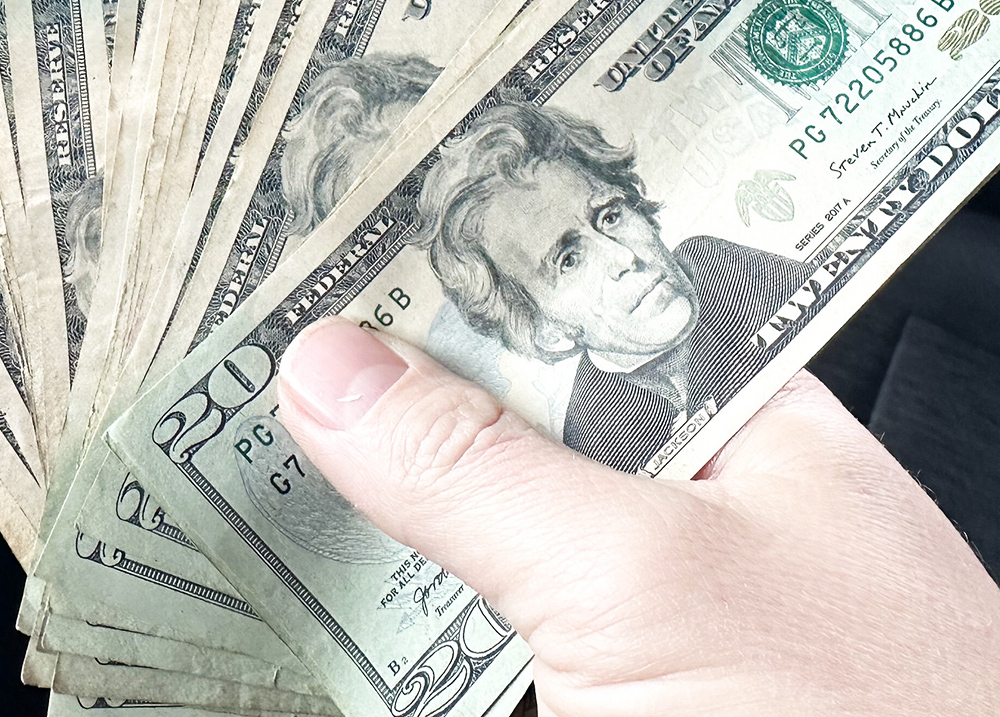 Hand holding cash
