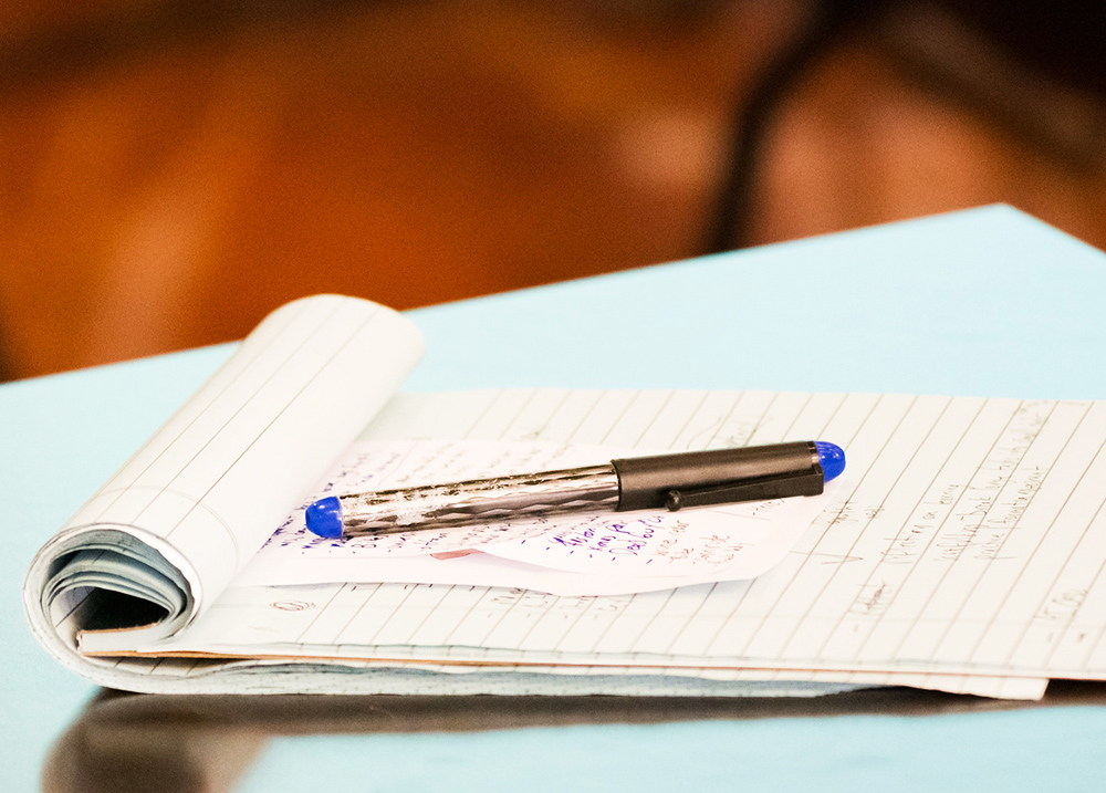 Pen resting on a notepad