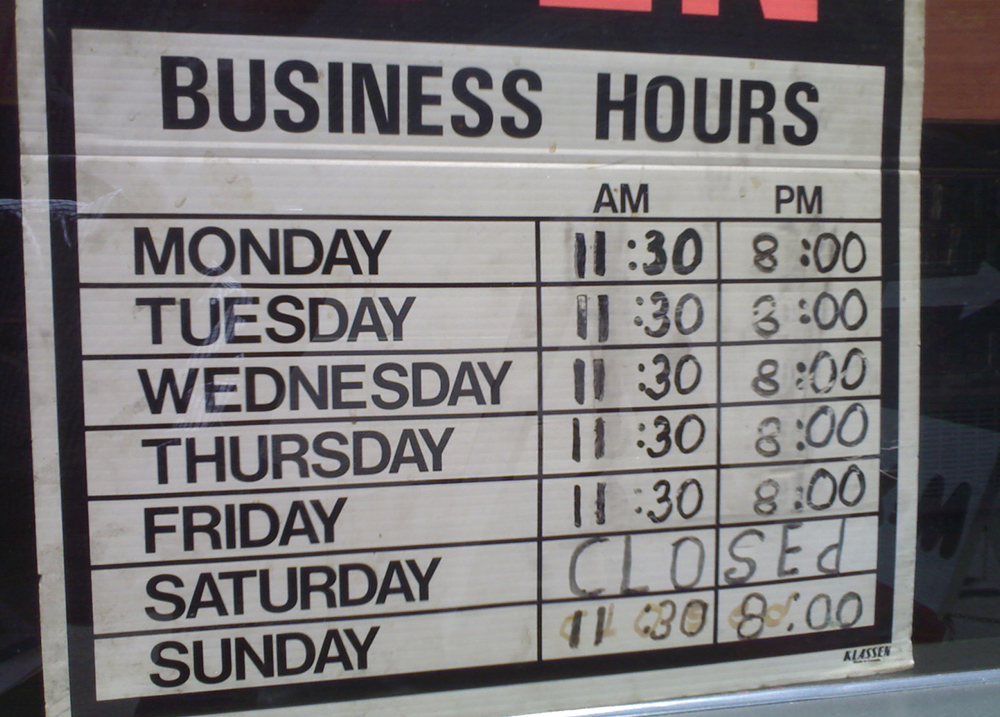 Sign with business hours