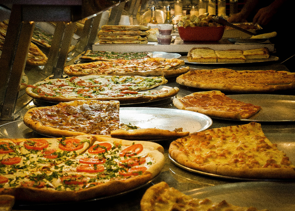 Pizzas for sale by the slice