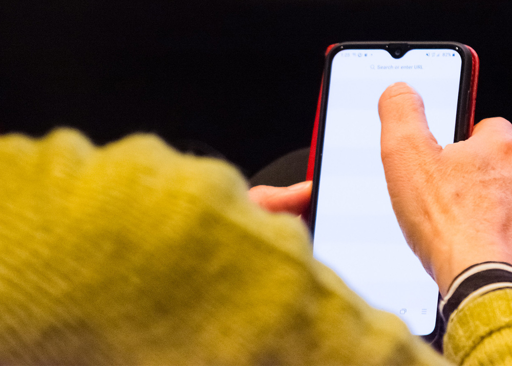Person searching the internet on their phone