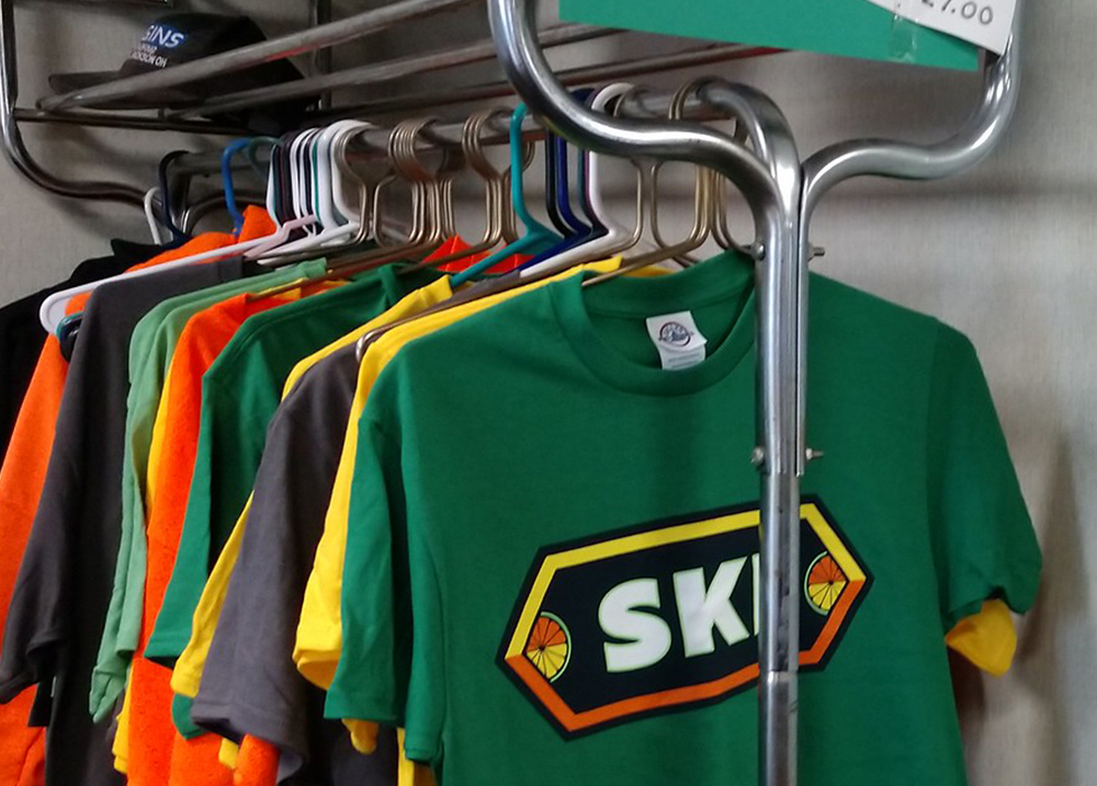 Shirts hanging on a clothing rack in a business