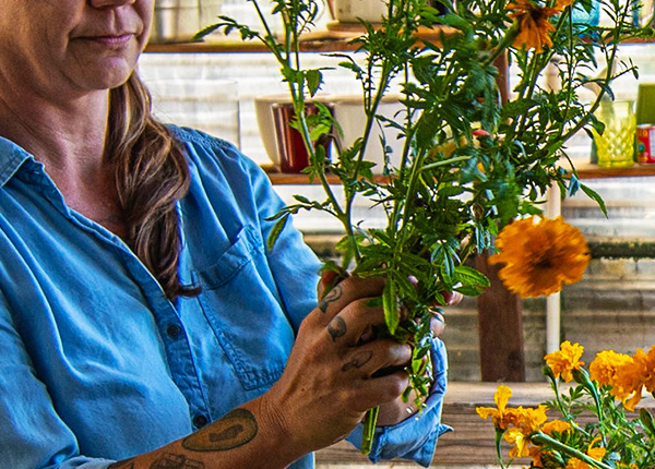 Close-up of hands making a floral arrangement