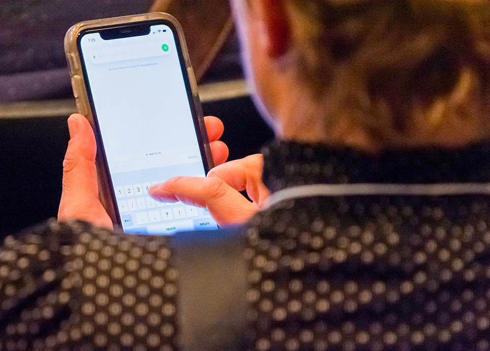 Person doing a web search on a smartphone