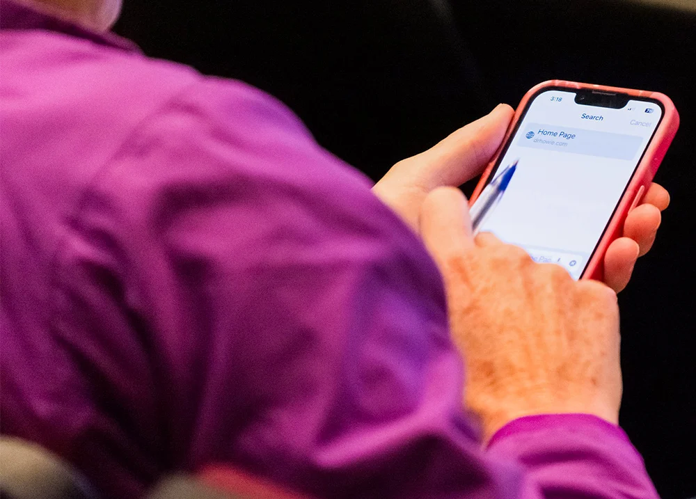 Person tapping on their phone screen