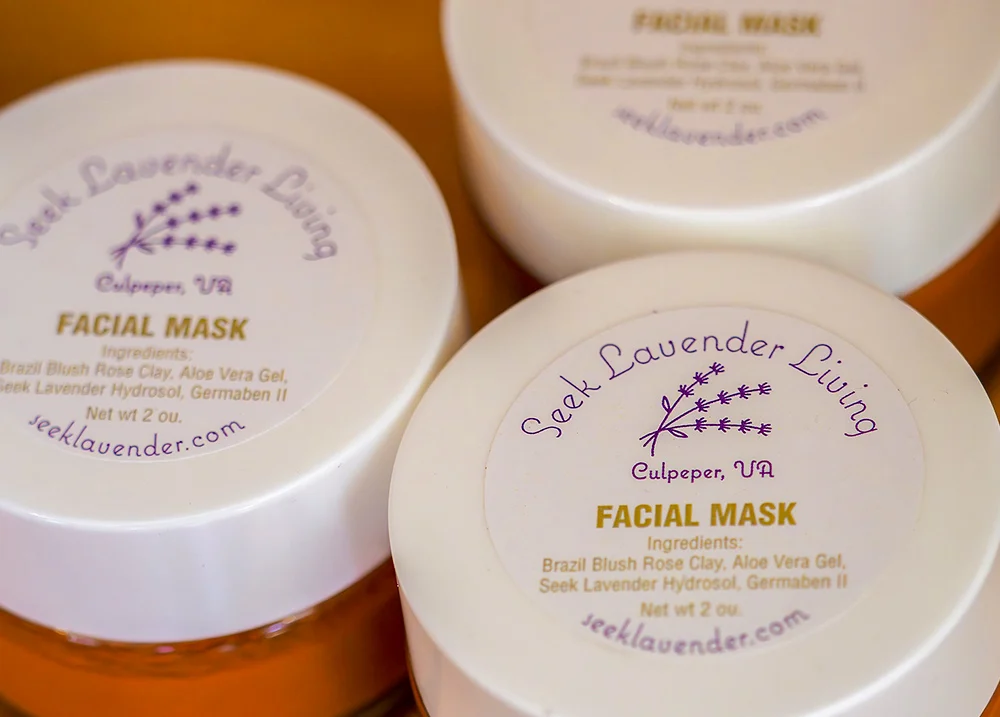 Containers of beauty products with stickers on the top