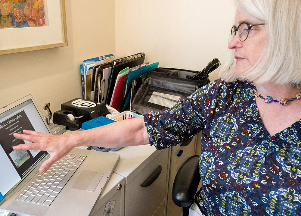 Woman looking at a laptop