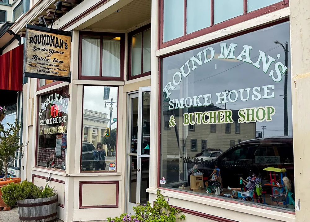 Storefront that says Roundman's Smoke House and Butcher Shop