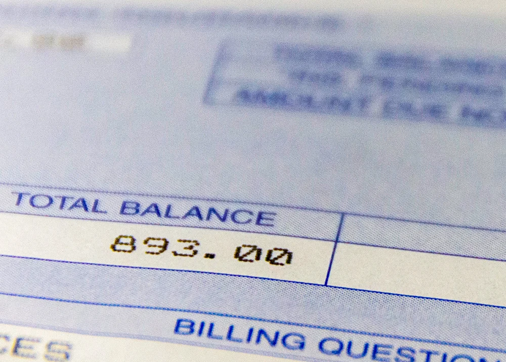 Bill highlighting a total balance of $893.00