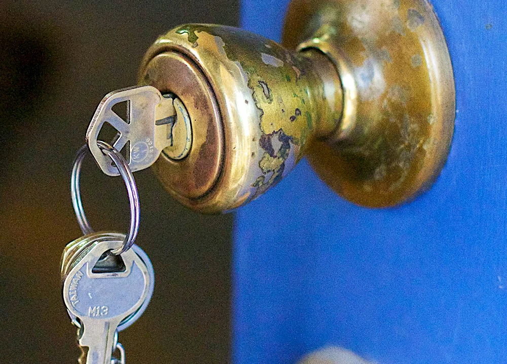 Keys hanging out of a door handle