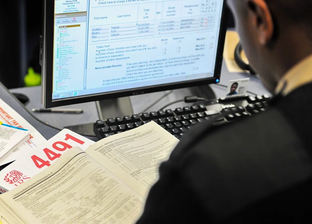 Accountant doing taxes using a computer program