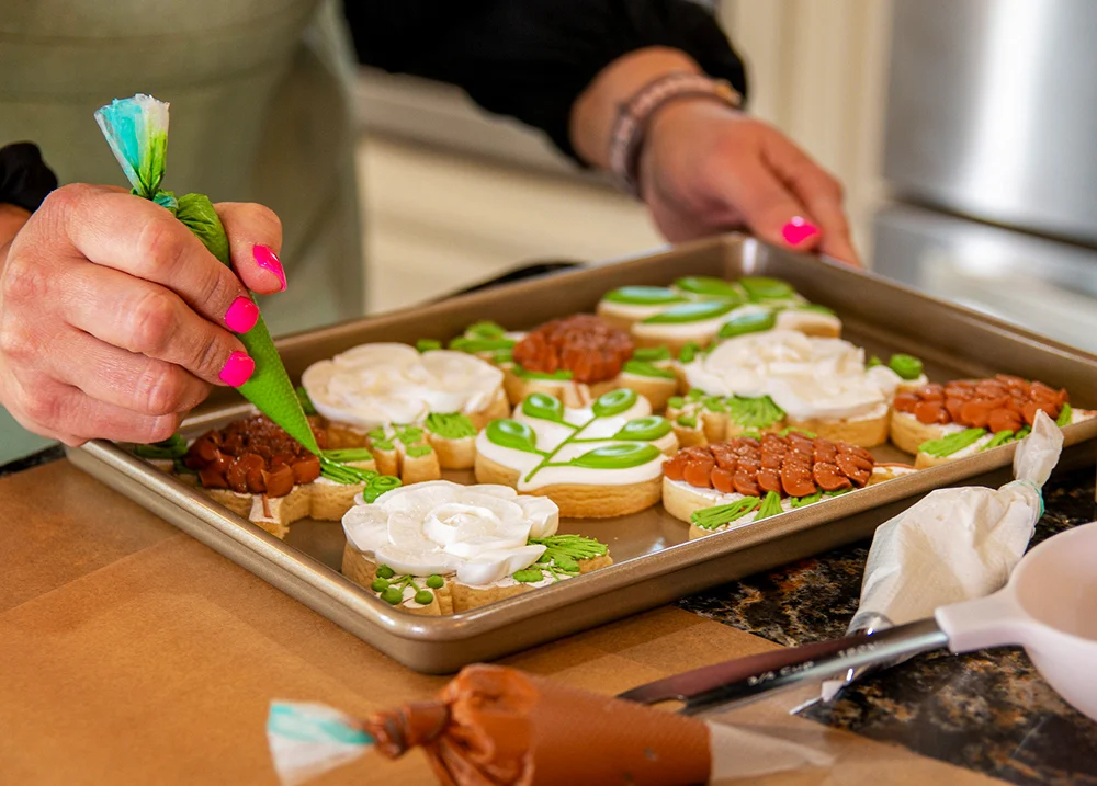 Person decorating cookies