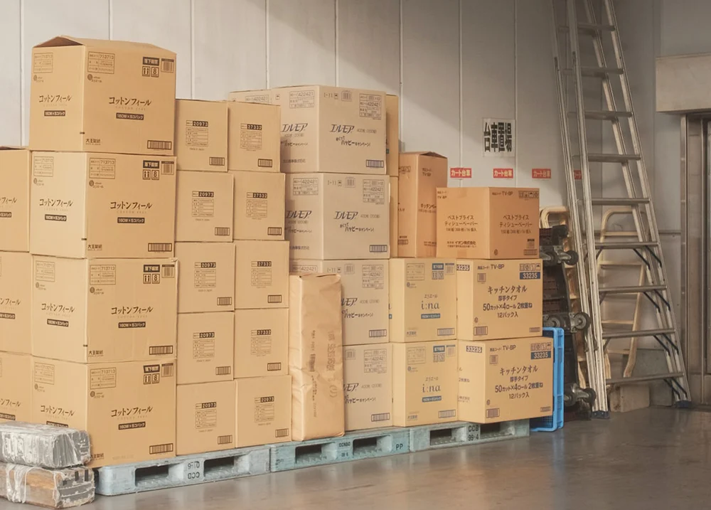 Boxes stacked along a wall